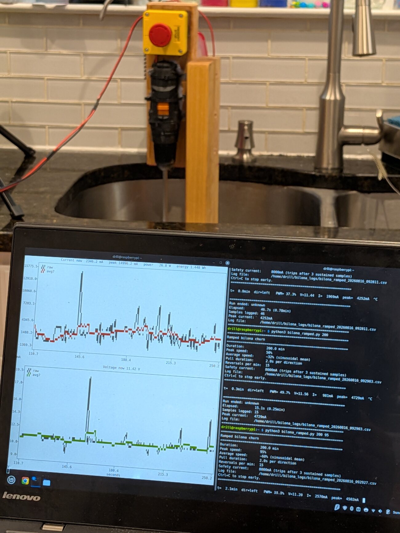 The rig clamped in position above the kitchen sink with a laptop below it showing live plots.